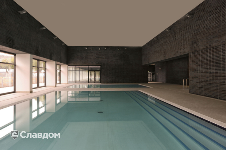 Здание бассейна с облицовкой фасадной плиткой Stroeher Keravette Chromatic 336 metallic black