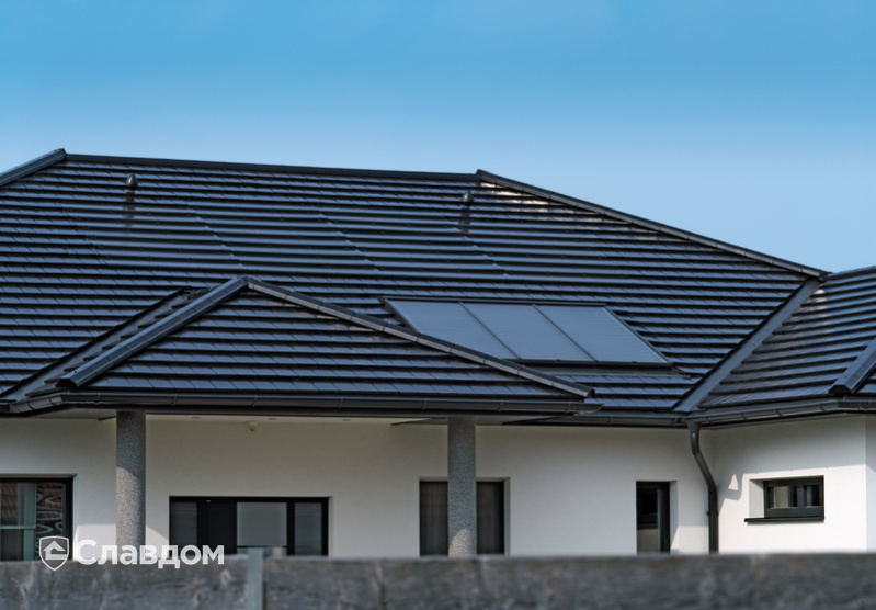 Крыша частного дома из черепицы Creaton Domino Schwarz Glasiert