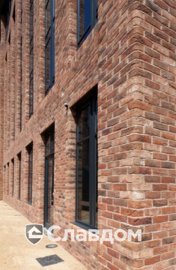 The Womens Organisation с облицовкой кирпичом Terca Topaas