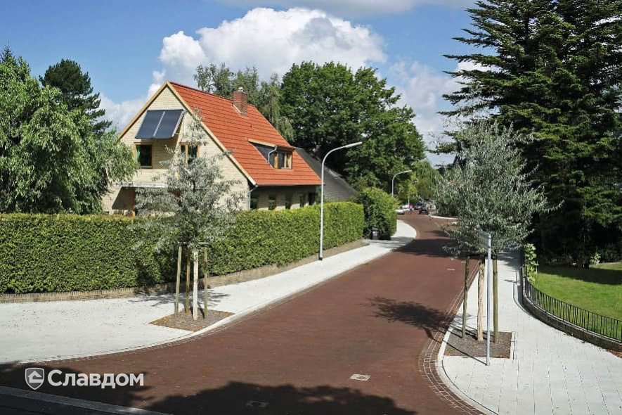 Улица в поселке с применением брусчатки Penter Nussbraun