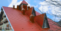 Жилой дом с применением цементно-песчаной черепицы Braas Франкфуртская красного цвета
